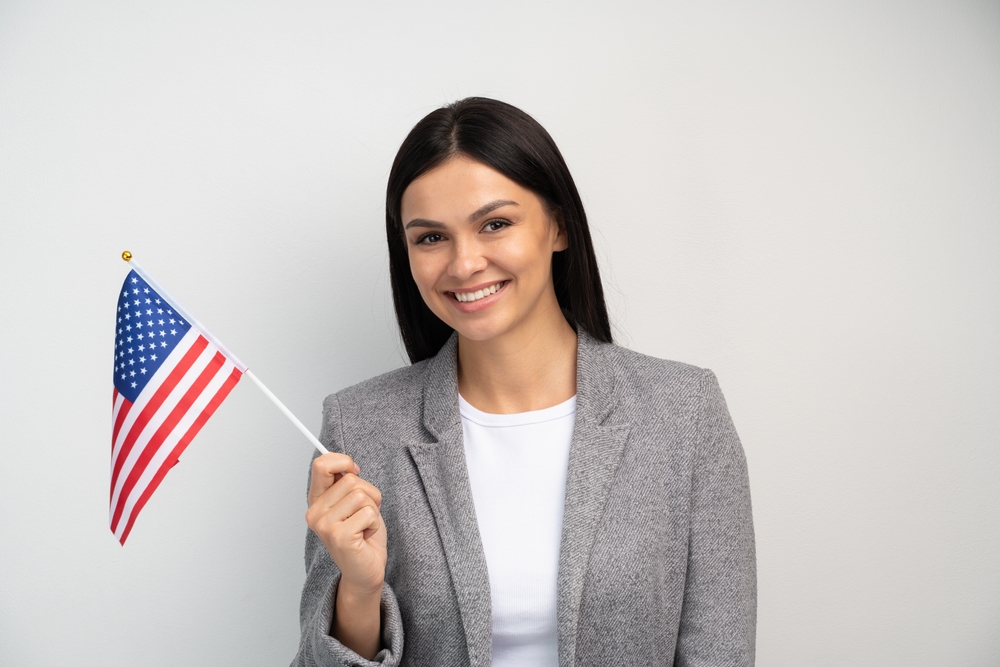 Female immigrant with American flag