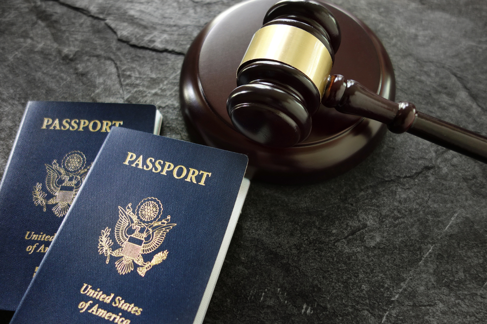 passports on a table with gavel in San Diego discussing H-1b visas