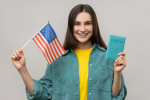 woman holding american flag after being approved for non immigrant visa